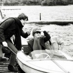 John Lennon and Paul McCartney on a boat at their hideaway in St Fillans Perthshire during their tour of Scotland. October 1964