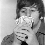 August 1964 Ringo Starr playing cards at rented Bel Air home during Beatles tour